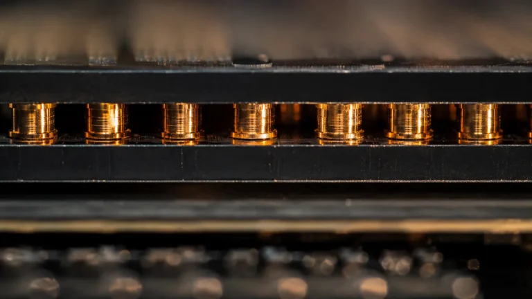 Hybrid bonding A macro photorealistic cross-section of two semiconductor chips fused together using solid copper interconnects.